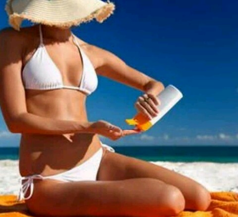 women sunbathing at the beach